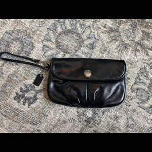 Coach patent black clutch